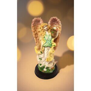 Vintage 90"s lovely resin angel in green holding fruit basket statue on wooden b